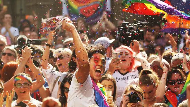 Melbourne crowds celebrate the marriage equality vote result. Picture: Getty Images